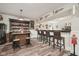 Basement bar area with ample seating, mood lighting, and unique decor, creating a cozy atmosphere at 1442 Avondale Dr, Westfield, IN 46074