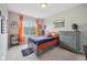 A cozy bedroom is adorned with baseball decorations, offering plenty of natural light and a relaxing ambiance at 1442 Avondale Dr, Westfield, IN 46074