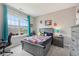 Well-lit bedroom with large window, stylish furniture and decor accents creates a comfortable and appealing space at 1442 Avondale Dr, Westfield, IN 46074