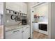 Coffee bar with ample storage and seamless access to the adjacent laundry room at 1442 Avondale Dr, Westfield, IN 46074