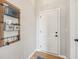 Entryway with wood floors, white door, and wall organizer at 1442 Avondale Dr, Westfield, IN 46074