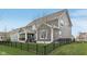Rear exterior view of home with a fenced yard, patio, and outdoor seating areas at 1442 Avondale Dr, Westfield, IN 46074