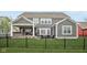 Backyard with a fire pit, covered deck, and privacy fence at 1442 Avondale Dr, Westfield, IN 46074