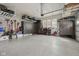 Spacious garage with epoxy floors, custom cabinets, and overhead storage racks at 1442 Avondale Dr, Westfield, IN 46074