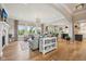 Bright and open living room with hardwood floors, fireplace, and a seamless connection to the kitchen at 1442 Avondale Dr, Westfield, IN 46074