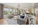 Bright and airy living room with hardwood floors, comfortable seating, and a seamless connection to the kitchen at 1442 Avondale Dr, Westfield, IN 46074