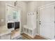 Well-organized mudroom area with built-in bench, storage, and access to laundry room for added convenience at 1442 Avondale Dr, Westfield, IN 46074
