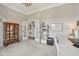 Home office with neutral walls, a large cabinet, and a view into the entryway at 1442 Avondale Dr, Westfield, IN 46074