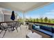 Covered patio with comfortable seating and a lovely view of the green space at 1442 Avondale Dr, Westfield, IN 46074