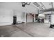 Spacious garage with storage cabinets, work bench area, and access doors at 15250 Mooring E Cir, Carmel, IN 46033