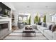 Bright living room with fireplace, stylish decor, and sliding glass doors leading to the backyard and patio at 15250 Mooring E Cir, Carmel, IN 46033