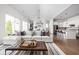 Open-concept living space featuring a comfortable sectional sofa, vaulted ceilings, and seamless kitchen access at 15250 Mooring E Cir, Carmel, IN 46033