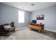 Office features a floating wooden desk, a comfortable chair, and a large bright window at 15250 Mooring E Cir, Carmel, IN 46033