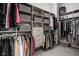 Beautiful walk-in closet features custom shelving, drawers, and clothes racks for optimal organization at 15250 Mooring E Cir, Carmel, IN 46033
