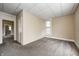 Bedroom featuring tan colored walls, soft carpet, and natural light at 156 S Cross St, Clayton, IN 46118