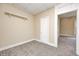 Neutral bedroom featuring plush carpeting, a built-in shelf, and classic white trim detail at 156 S Cross St, Clayton, IN 46118