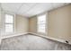 Bedroom featuring tan colored walls, soft carpet, and natural light at 156 S Cross St, Clayton, IN 46118