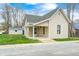 Charming single-story home with vinyl siding and a cozy front porch at 156 S Cross St, Clayton, IN 46118