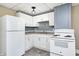 Modern kitchen with stainless steel appliances, ample cabinet space, and granite countertops at 156 S Cross St, Clayton, IN 46118