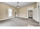 Carpeted living room featuring recessed lighting, a window, and access to other rooms at 156 S Cross St, Clayton, IN 46118