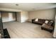 Spacious basement with cozy carpeting, a sectional sofa, and a neutral color palette at 15958 Oakhurst Ln, Fishers, IN 46040