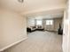 Finished basement with neutral carpet, ample natural light, and a comfortable sectional sofa at 15958 Oakhurst Ln, Fishers, IN 46040