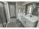 Bathroom with double sink vanity, walk-in shower, and tiled floors at 15958 Oakhurst Ln, Fishers, IN 46040