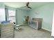 Charming Bedroom with a crib, dresser, and rocking chair, bathed in natural light at 15958 Oakhurst Ln, Fishers, IN 46040