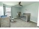 Charming Bedroom with a crib, dresser, and rocking chair, bathed in natural light at 15958 Oakhurst Ln, Fishers, IN 46040