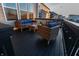 Outdoor deck featuring wicker furniture with blue cushions, creating an inviting space for relaxation and entertainment at 15958 Oakhurst Ln, Fishers, IN 46040