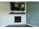 Living room fireplace with white shiplap and floating mantel at 15958 Oakhurst Ln, Fishers, IN 46040