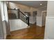 Beautiful entryway with hardwood floors, black staircase, and bright natural light at 15958 Oakhurst Ln, Fishers, IN 46040