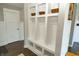 Hallway features built-in storage with hooks and shelving, plus hardwood floors at 15958 Oakhurst Ln, Fishers, IN 46040