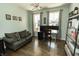 Bright home office with hardwood floors, a modern light fixture, and a functional workspace at 15958 Oakhurst Ln, Fishers, IN 46040