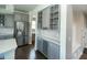 Kitchen area with custom cabinetry, wine storage, and stainless steel refrigerator at 15958 Oakhurst Ln, Fishers, IN 46040