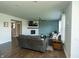 Open-concept living room with a fireplace, hardwood floors, and plenty of seating at 15958 Oakhurst Ln, Fishers, IN 46040
