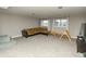 Spacious living room features plush carpeting, a comfortable sectional couch, and natural light from dual windows at 15958 Oakhurst Ln, Fishers, IN 46040