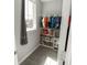 Charming walk-in closet with a window for lots of natural light and great built-in storage spaces at 15958 Oakhurst Ln, Fishers, IN 46040