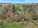 An aerial view of the home surrounded by trees, featuring a beautiful rural landscape at 2025 State Road 47, Lebanon, IN 46052
