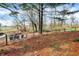 Backyard view featuring Adirondack chairs and a creek side setting at 2025 State Road 47, Lebanon, IN 46052