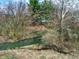 Enjoy the outdoors with a stream, chairs, and fire pit, perfect for relaxation and entertainment at 2025 State Road 47, Lebanon, IN 46052
