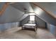 Cozy bedroom featuring a gray accent wall, a ceiling fan, and natural light from the window at 2025 State Road 47, Lebanon, IN 46052