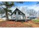 Stylish A-frame home boasting a large deck, perfect for outdoor entertaining and enjoying nature at 2025 State Road 47, Lebanon, IN 46052
