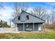 Cottage exterior with swing bench at 2025 State Road 47, Lebanon, IN 46052