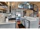 Modern kitchen featuring stainless steel appliances, gray cabinetry, and an open layout with natural light at 2025 State Road 47, Lebanon, IN 46052