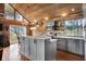 Charming kitchen features gray cabinets, modern appliances, and an island, creating a cozy and functional space at 2025 State Road 47, Lebanon, IN 46052
