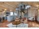 Cozy living room boasts wooden ceilings, hardwood floors, and a unique spiral staircase to the loft at 2025 State Road 47, Lebanon, IN 46052