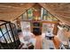Open-concept living room featuring hardwood floors, a ceiling fan, and abundant natural light from the large windows at 2025 State Road 47, Lebanon, IN 46052