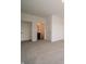 A neutral bedroom offers a door to an ensuite, along with carpet flooring at 211 Ames Dr, Whiteland, IN 46184