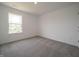 This room has a large bright window for great natural light and neutral carpet at 211 Ames Dr, Whiteland, IN 46184